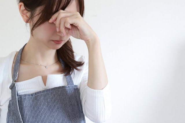 体調不良の女性